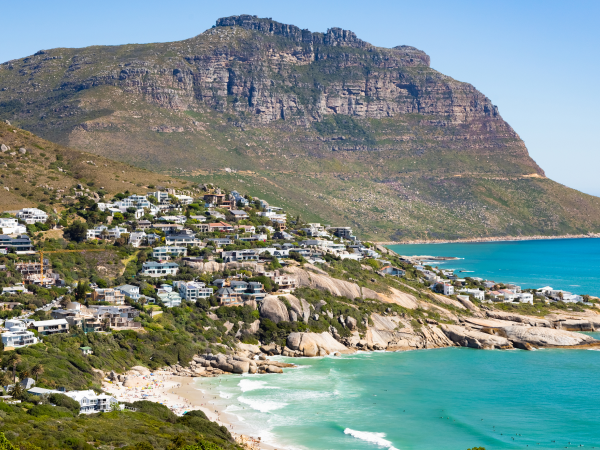 buildings on a hill at turquoise beach in cape town, south africa