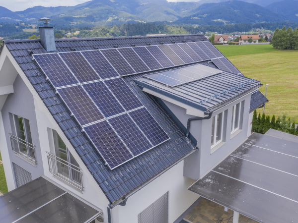Aerial view of a private house with solar panels on the roof